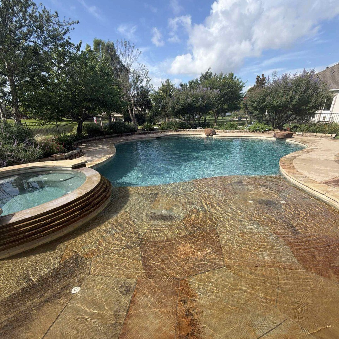 Natural lagoon-style pool with spa and mature trees